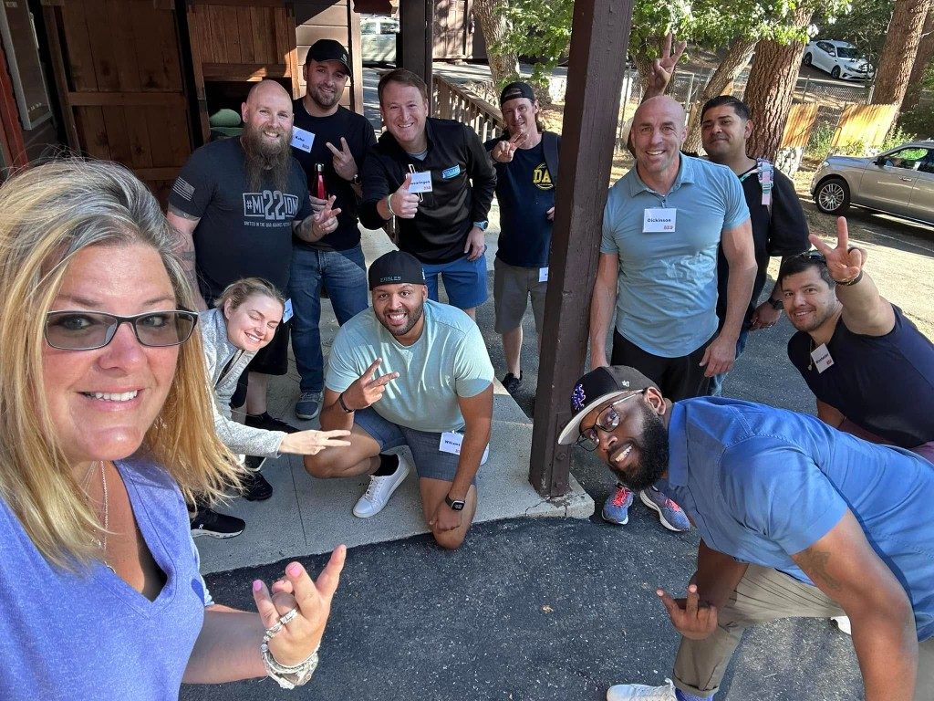 BOLD crew in black BOLD shirts taking an outdoor selfie