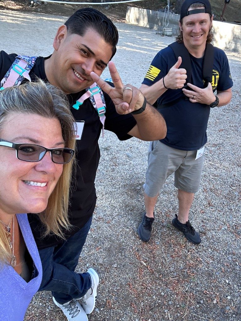 BOLD participants in black BOLD shirts taking an outdoor selfie