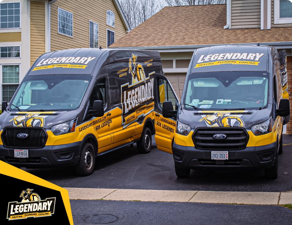 Legendary Service branded trucks with black and gold vehicle wraps