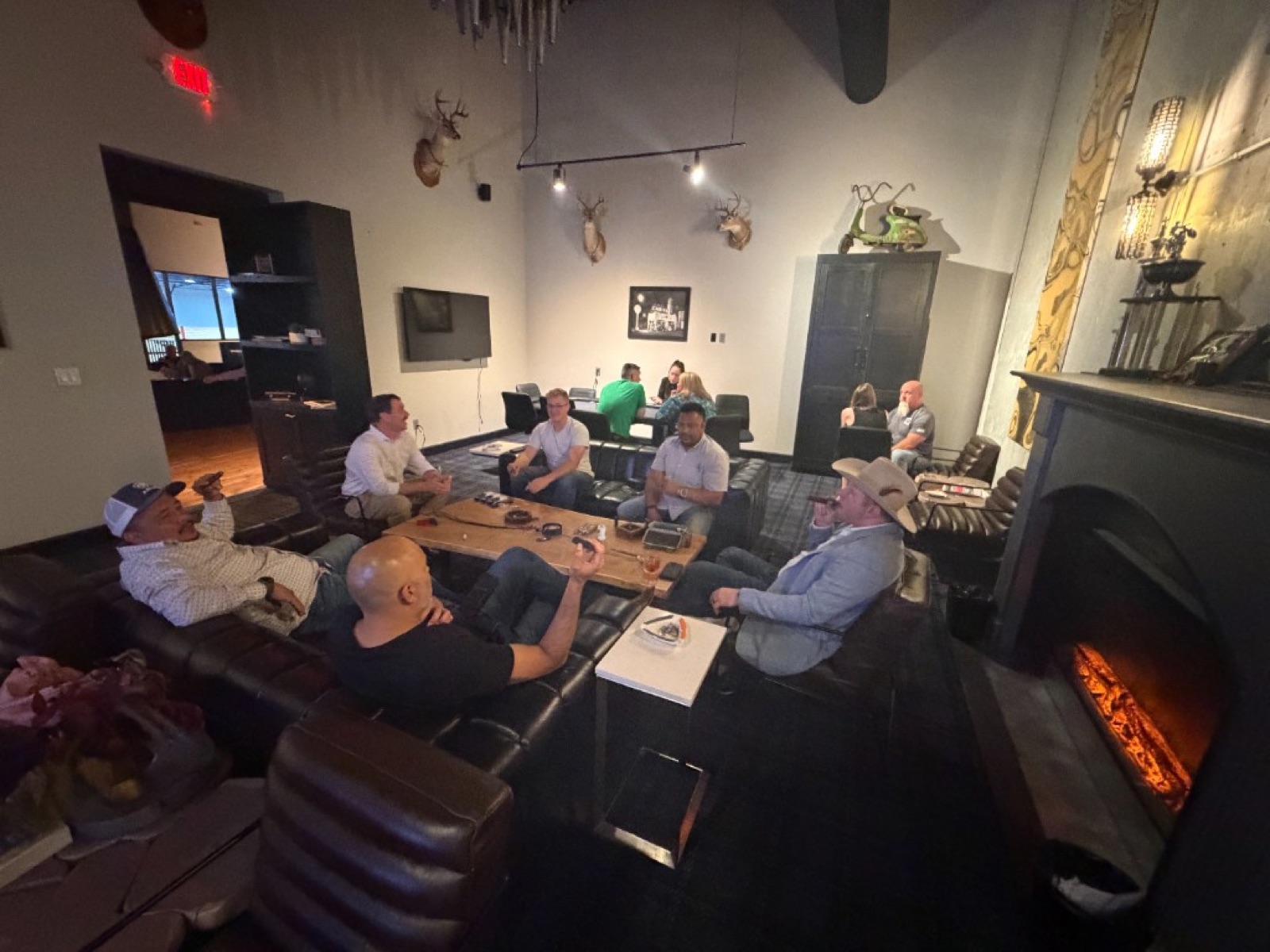CI Web Group team and clients networking in a lounge after an industry event