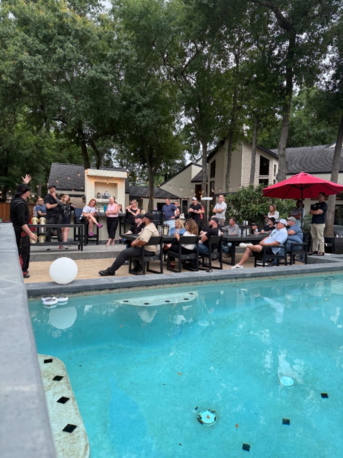 An intimate poolside learning session with trades operators at a CI Web Group community gathering