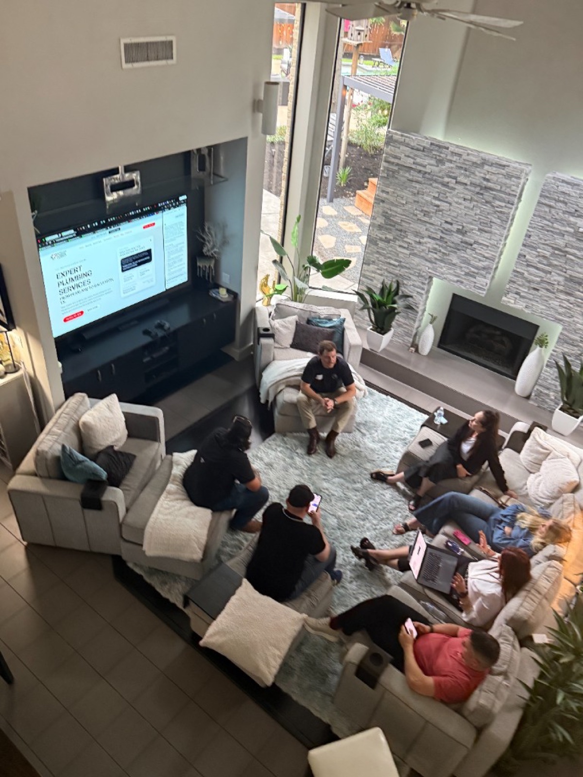 The CI Web Group team reviewing a client's plumbing website during a working session