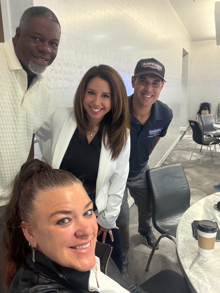 CI Web Group team members with the AirWorks Heating & Cooling owner at a strategy meeting