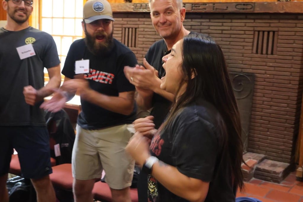 CI Web Group team members laughing together during a BOLD Advanced Leadership session