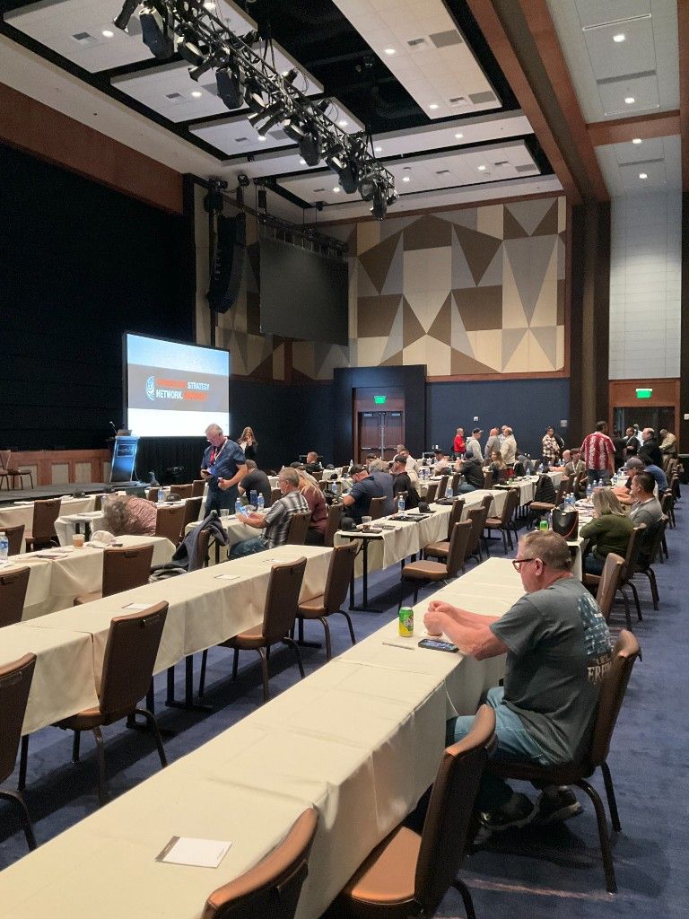 Attendees seated for a general session at a trades-industry conference