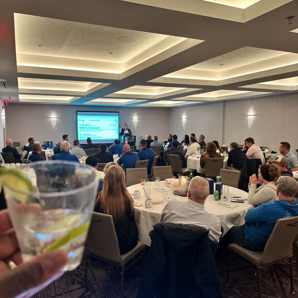 A full ballroom of contractors at a distributor dealer-meeting dinner