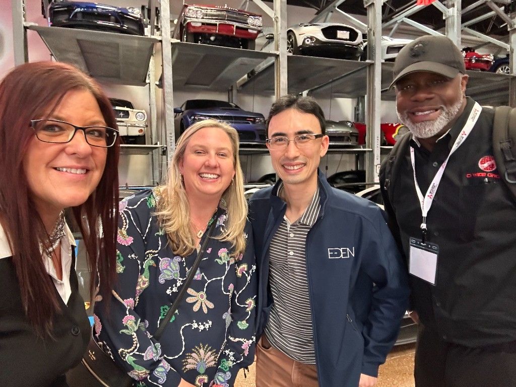 CI Web Group team networking with partners at an industry expo