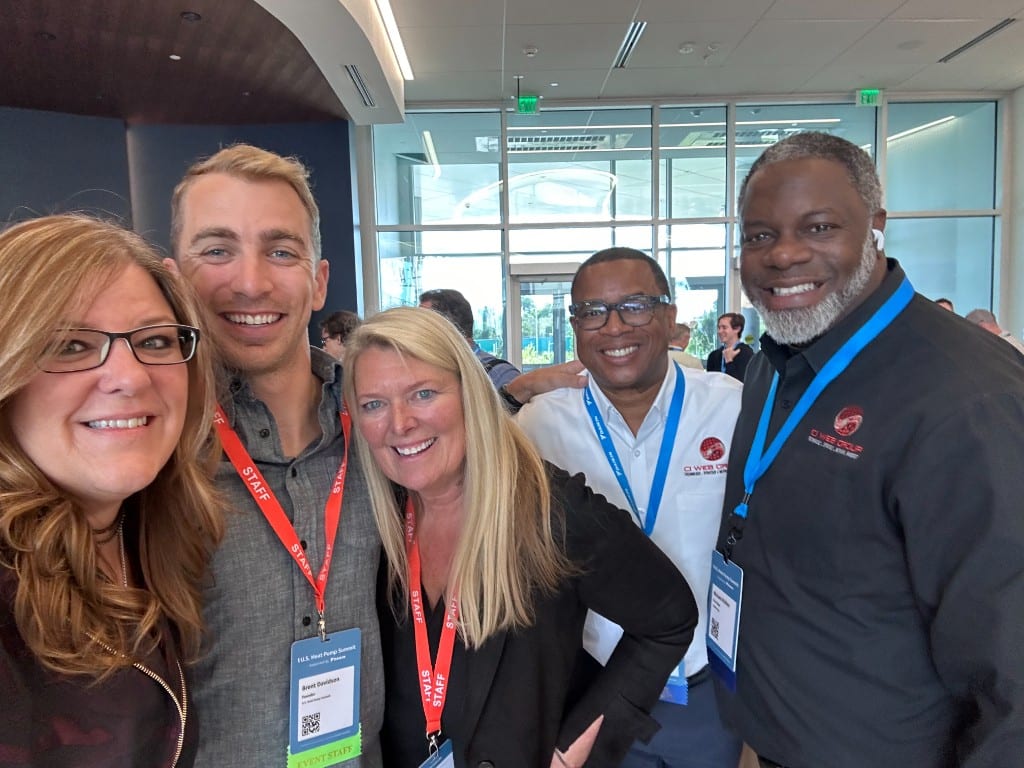 CI Web Group team members on staff at a heat pump summit