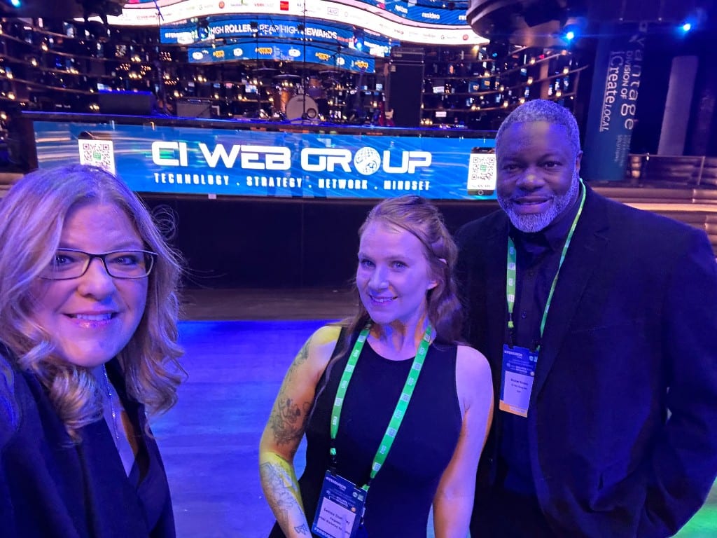 CI Web Group team in front of the stage at the High Rollers industry event