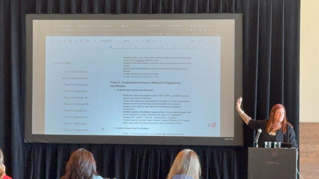 Jennifer Bagley of CI Web Group presenting an AI keyword and content strategy framework to a seated audience