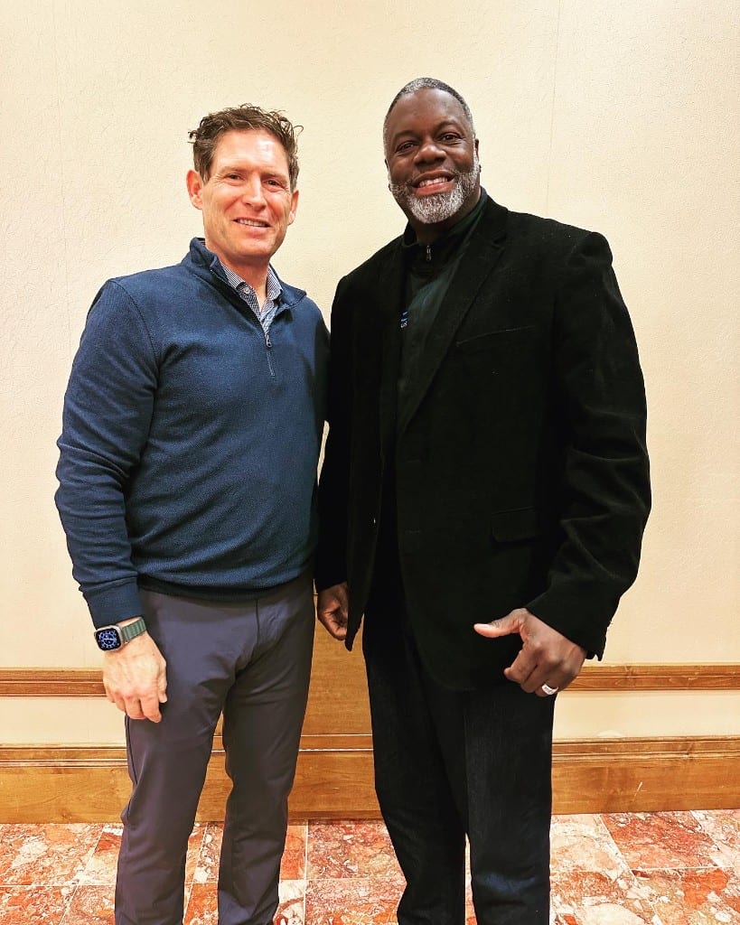 Two industry leaders together at a CI Web Group networking event