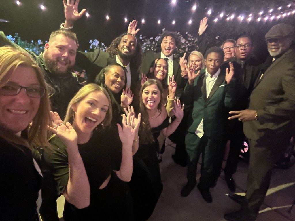 CI Web Group team and friends celebrating together at an event