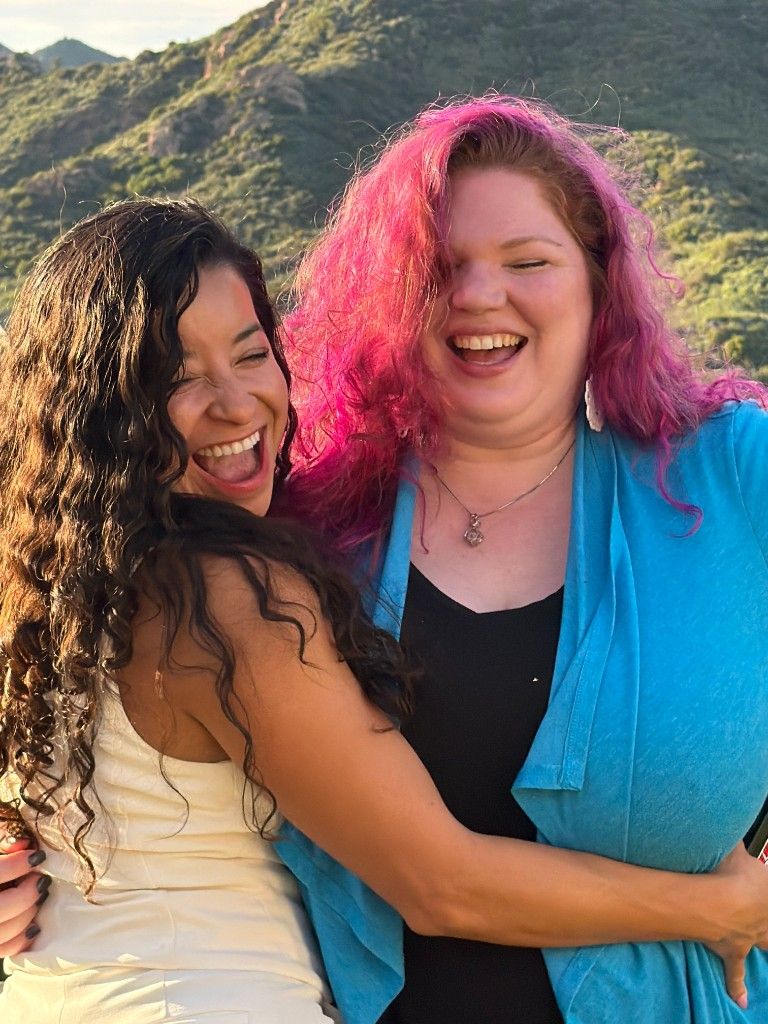 Two CI Web Group team members at a mountain overlook