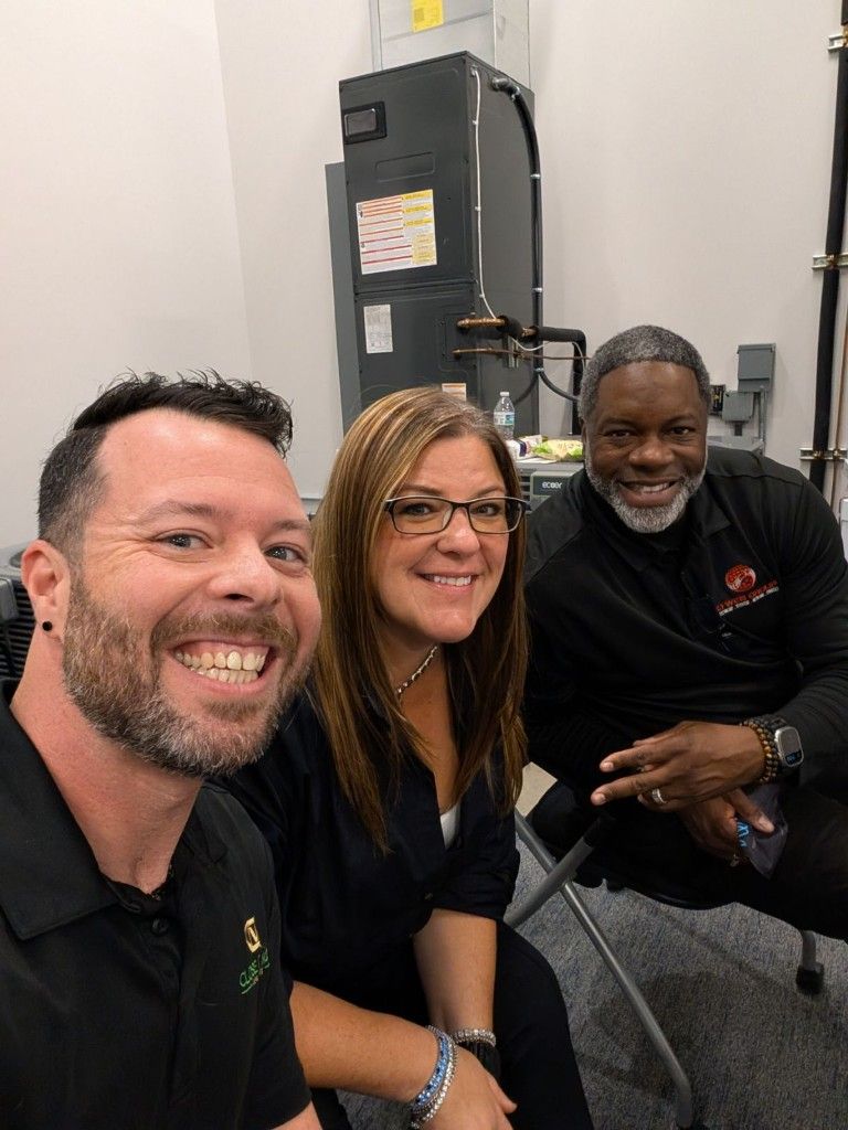 Three CI Web Group team members taking a selfie together
