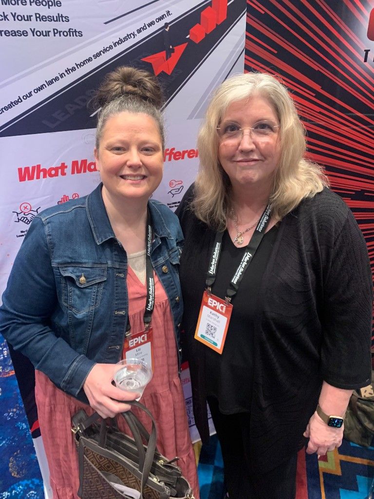 CI Web Group team members at a branded trade-show booth