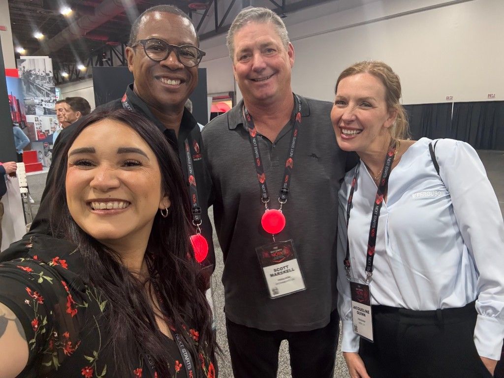CI Web Group team with partners on a trade-show floor