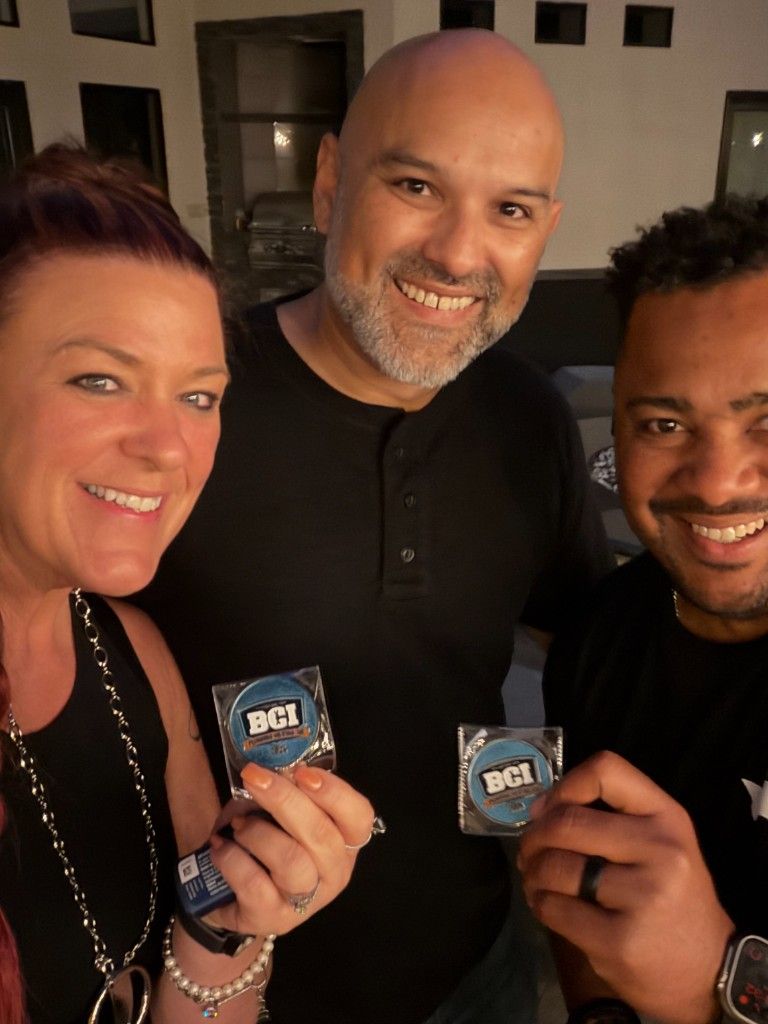 Three industry professionals holding awards at an HVAC industry event