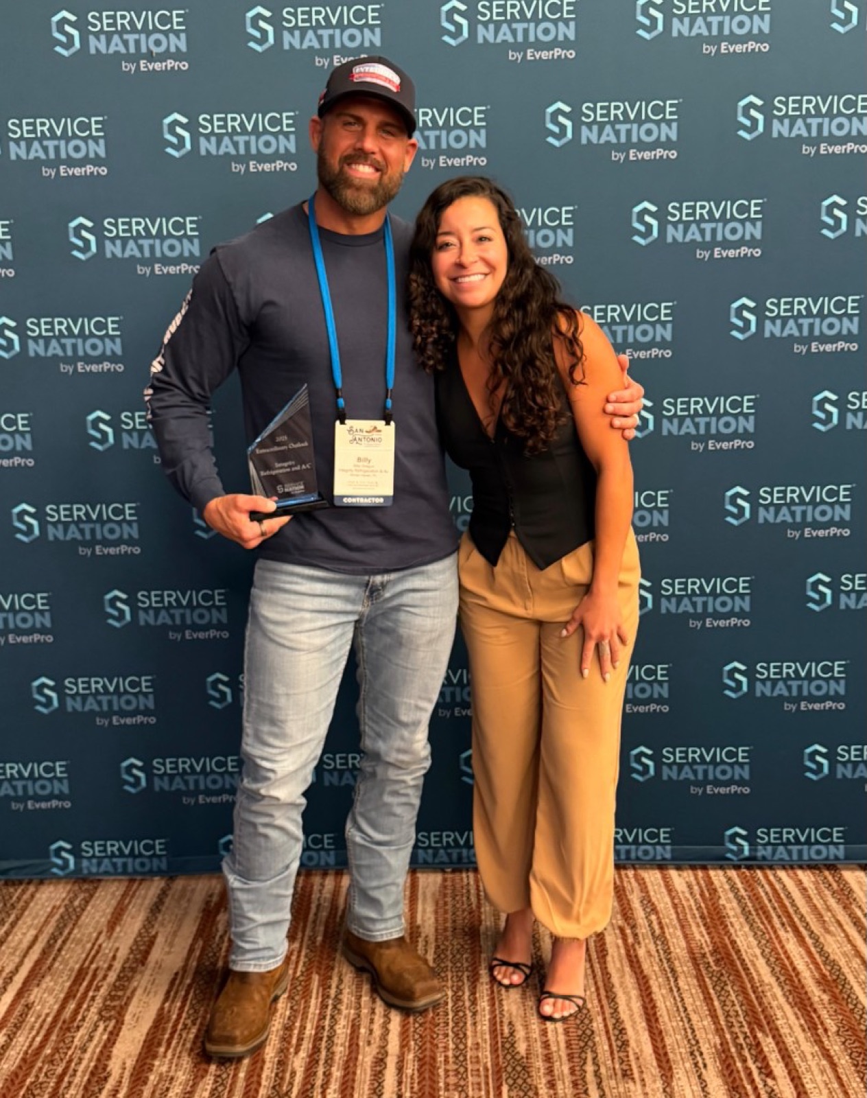 CI Web Group's Jazmin Ramirez with Billy of Integrity Refrigeration & A/C and his Service Nation by EverPro award