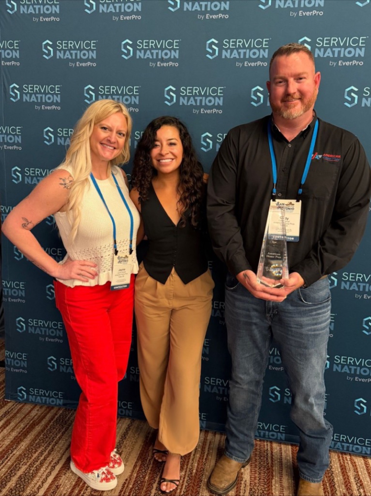 CI Web Group's Jazmin Ramirez with the American Home Pros team and their Service Nation by EverPro award
