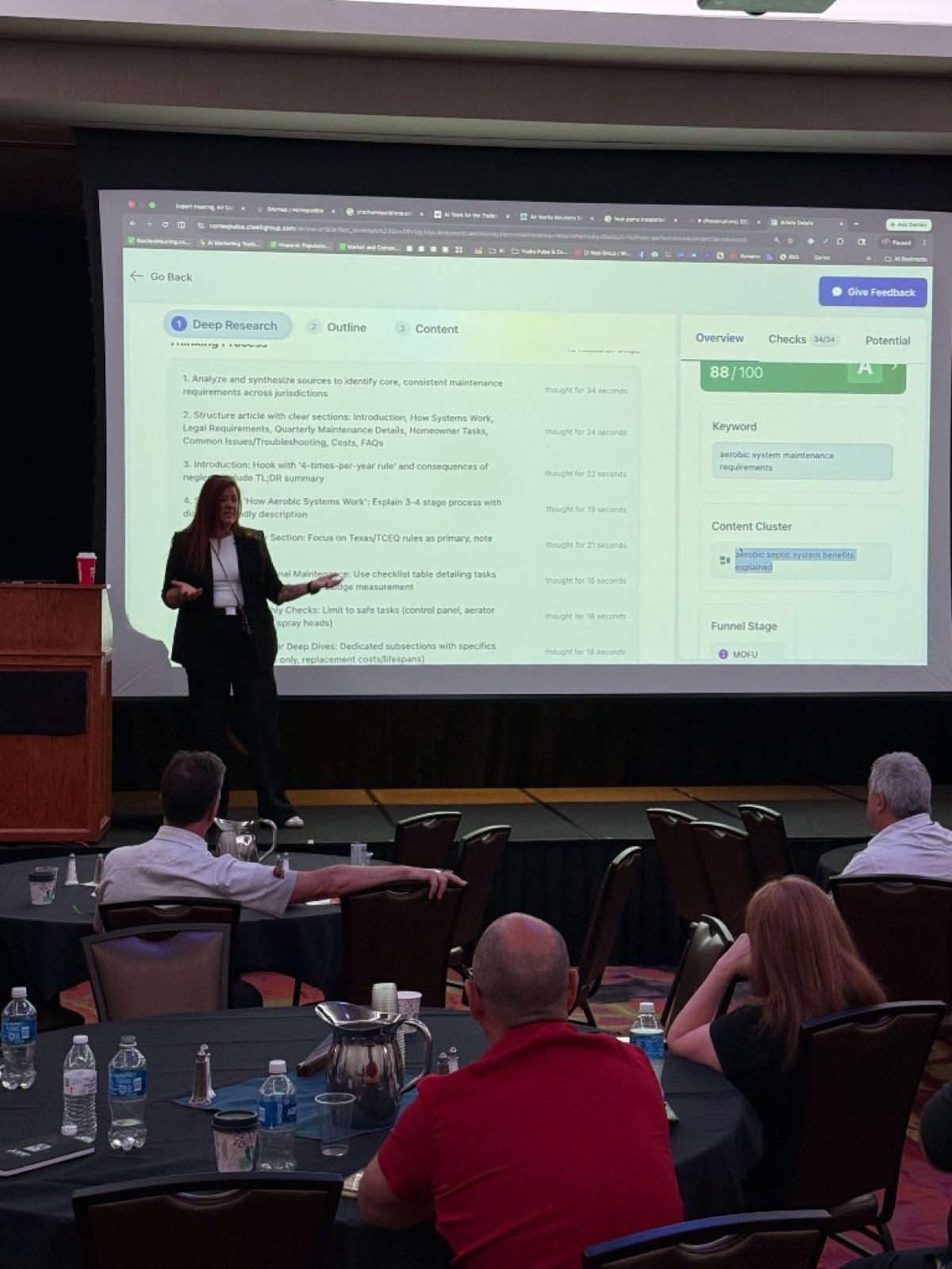 Jennifer Bagley of CI Web Group demonstrating the Cortex AI content engine live on stage