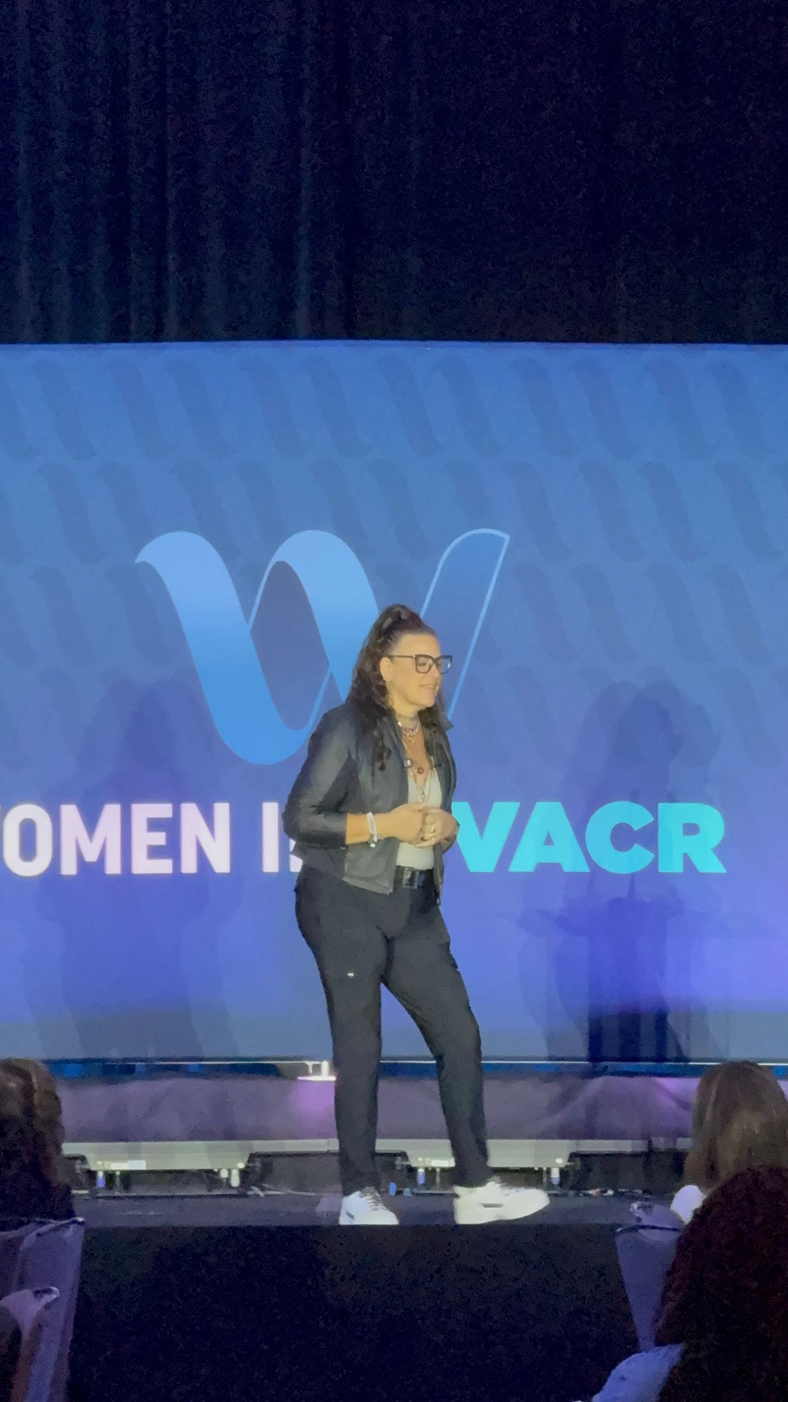 Jennifer Bagley speaking on stage at the Women in HVACR event
