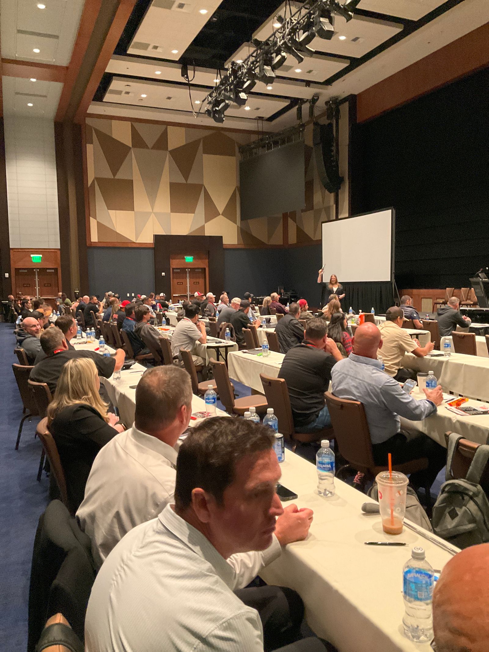 Jennifer Bagley presenting to a packed room of trades professionals